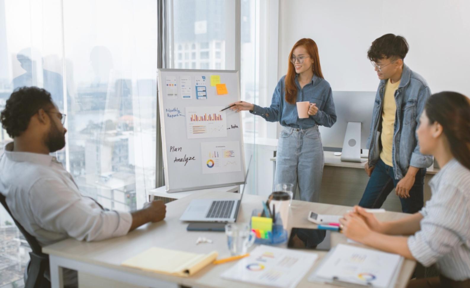 Financial professionals collaborating on budget strategies in modern workspace